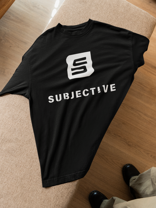 Living-SUbjective-oversized-t-shirt-lying-on-a-couch. Top View